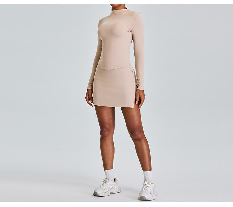 Ensemble de yoga slim à manches longues : jupe de sport trapèze taille haute avec short intégré et tenue de fitness